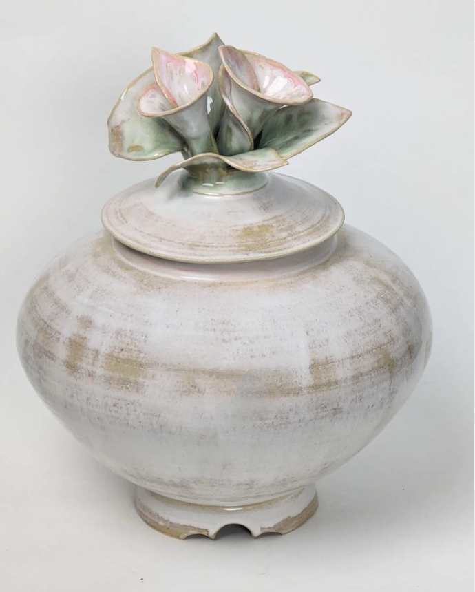 white ceramic with two flowers on lid by margaret hutcheson