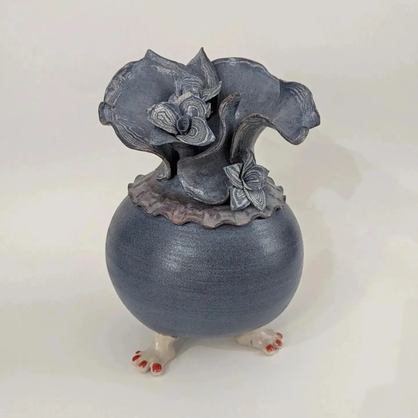 blue ceramic with feet and flowers by margaret hutcheson
