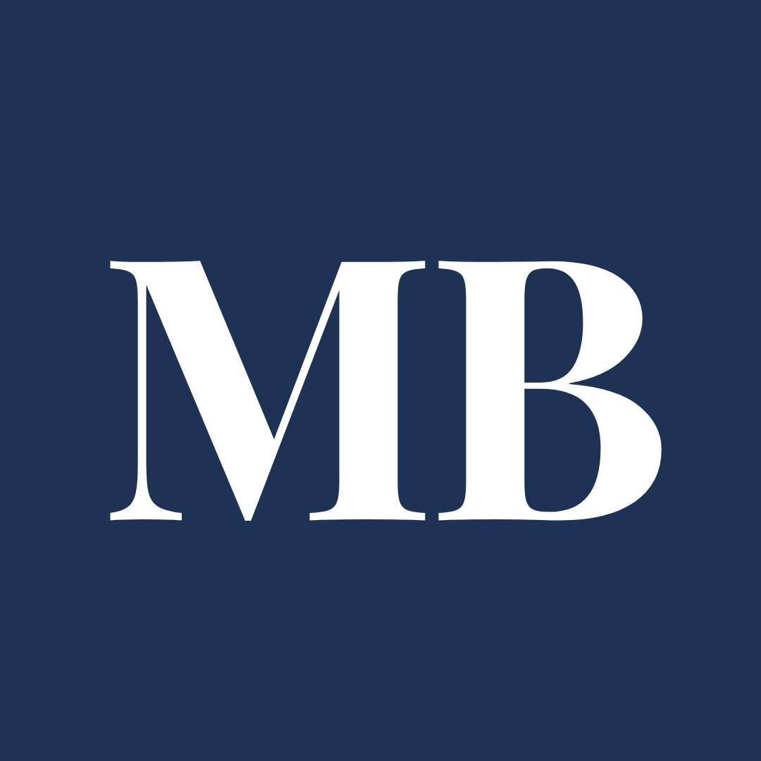 White 'MB' logo on a blue background for Mobile Bay Magazine