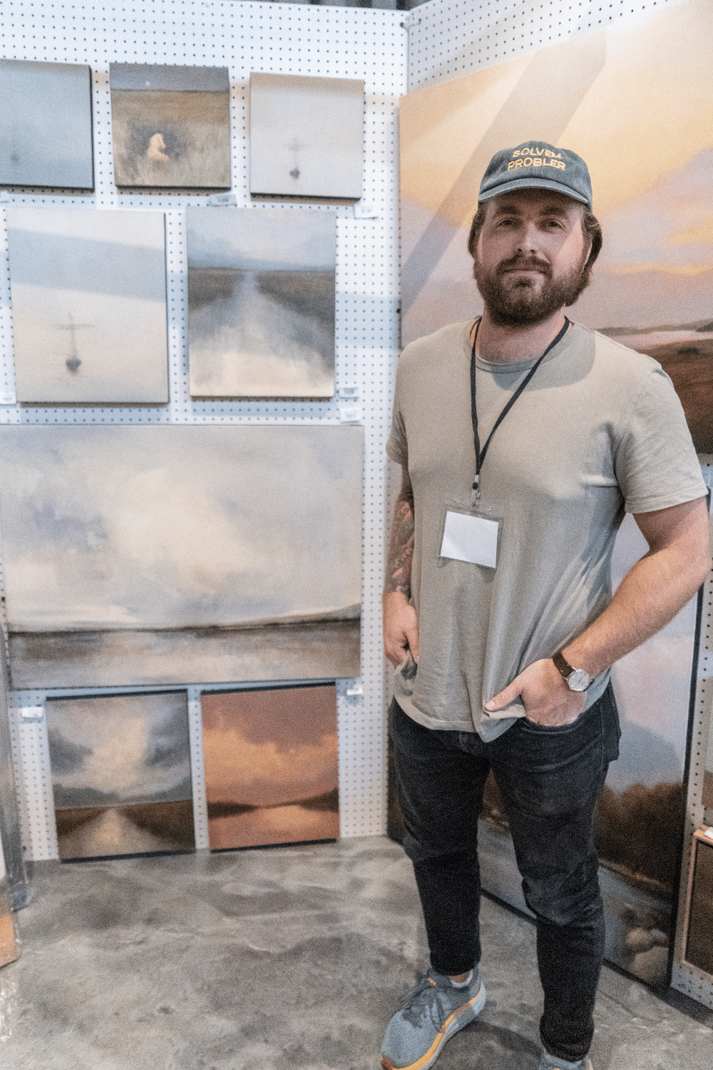 artist shane miller in his booth at the loyola art show